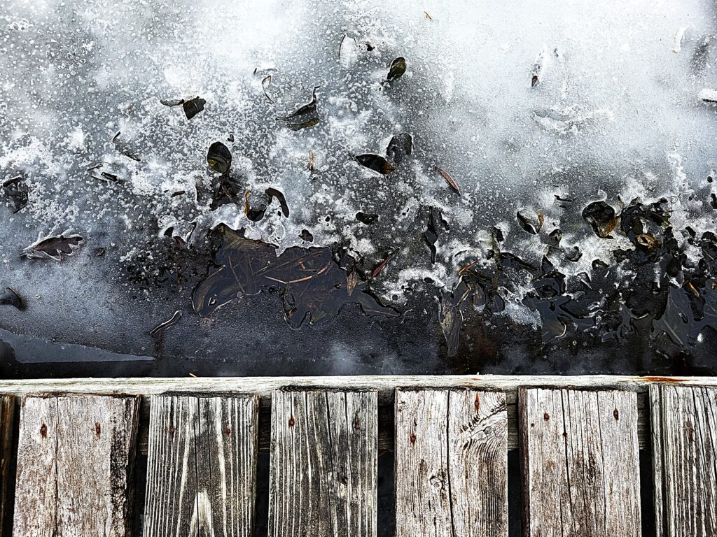 weathered dock icy water